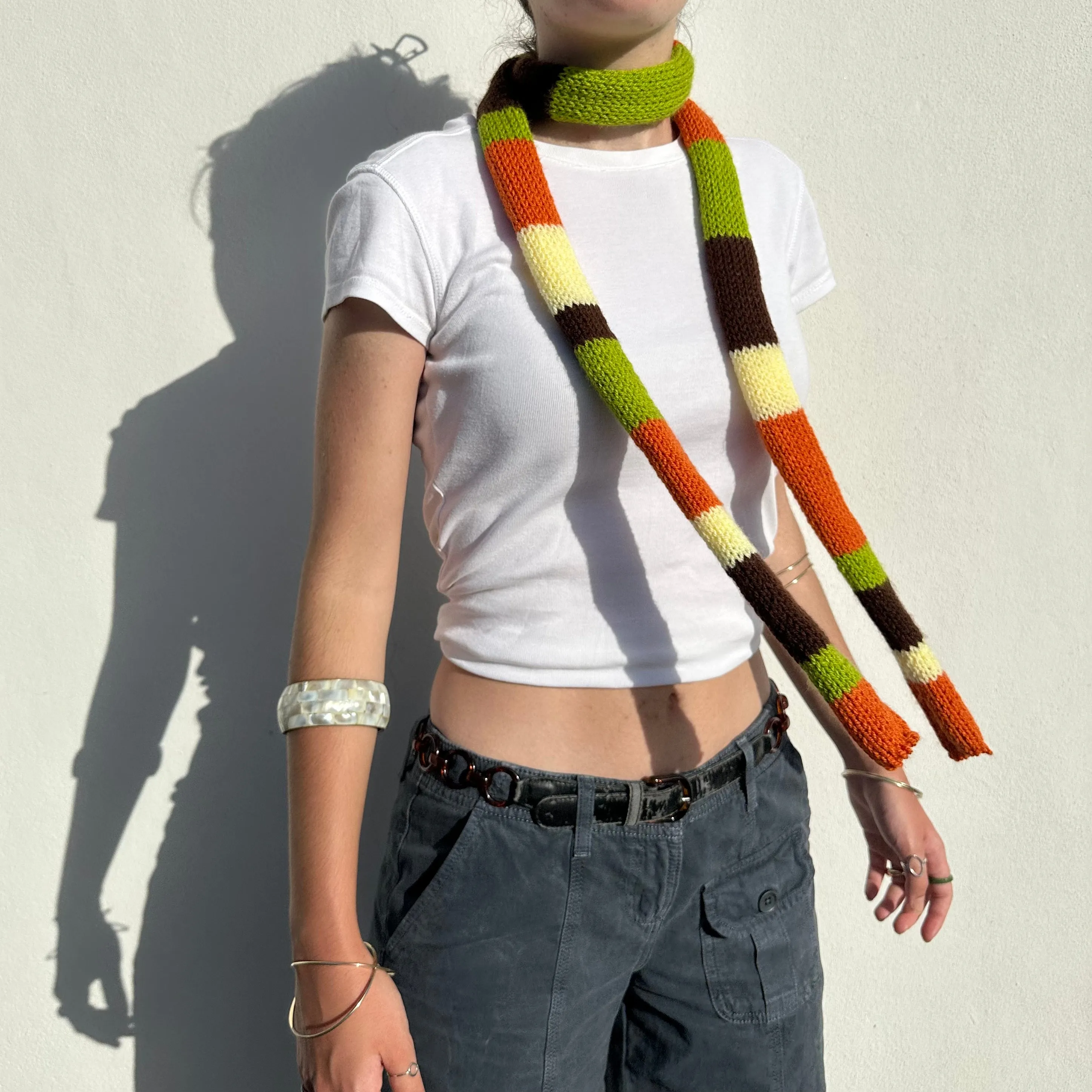 The Linea Scarf - handmade knitted stripy skinny scarf in orange, brown green and yellow